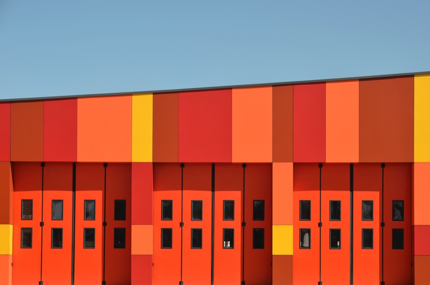 Bright looking Fire station with red garage doors