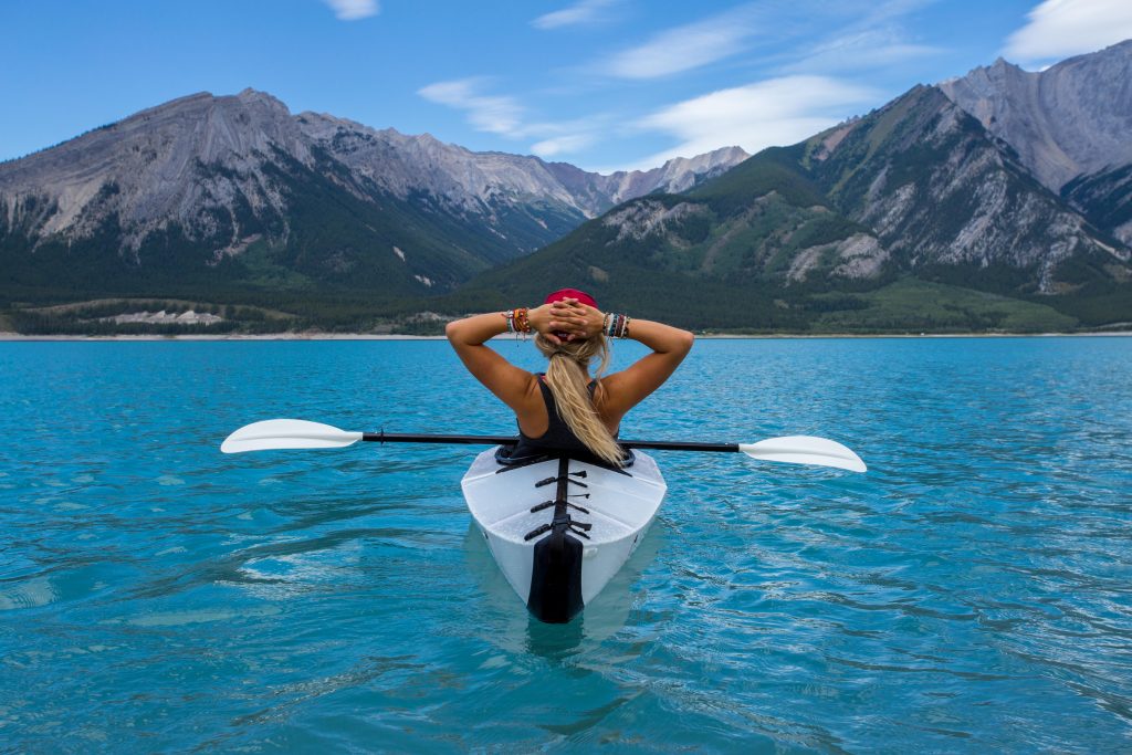 woman in a canoe, taking a break